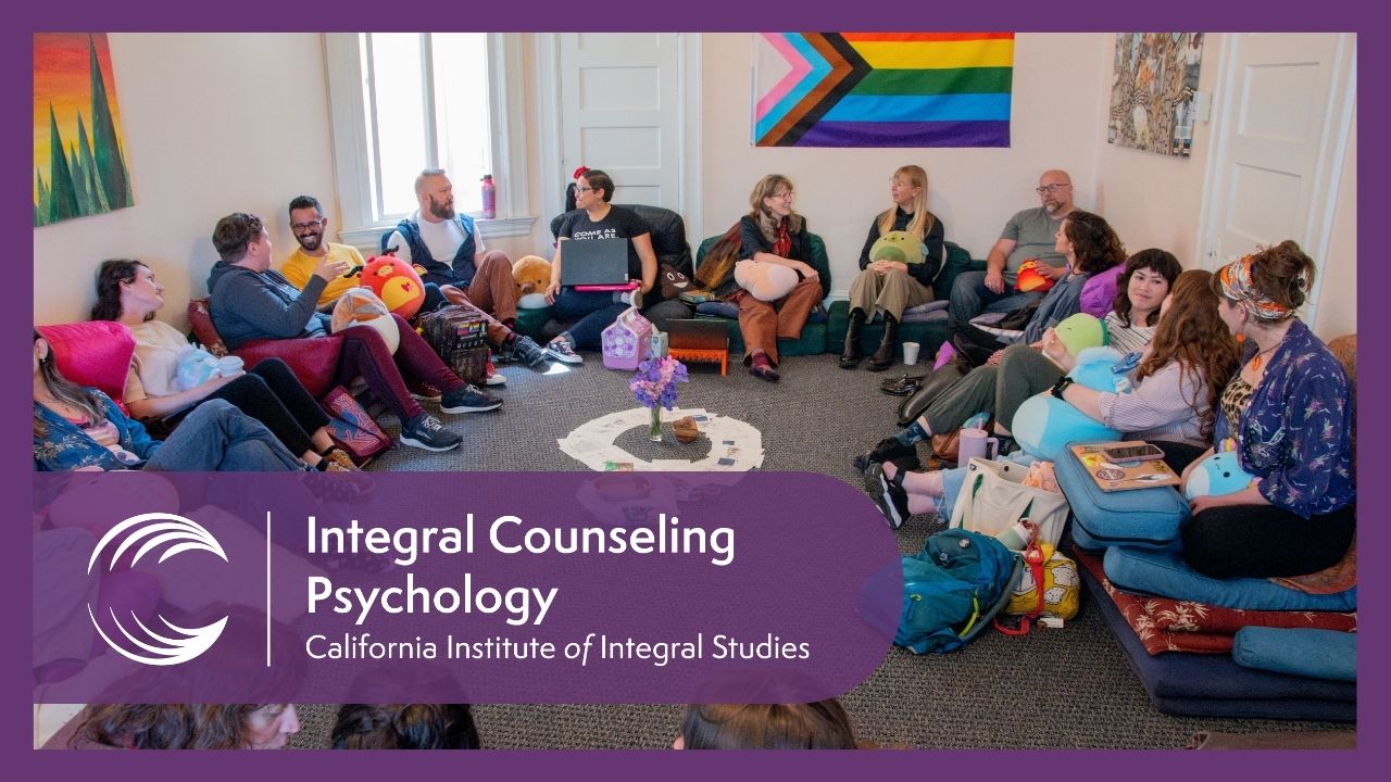 Integral Counseling Psychology students and faculty seated in a circle in a CIIS classroom for an experiential session.